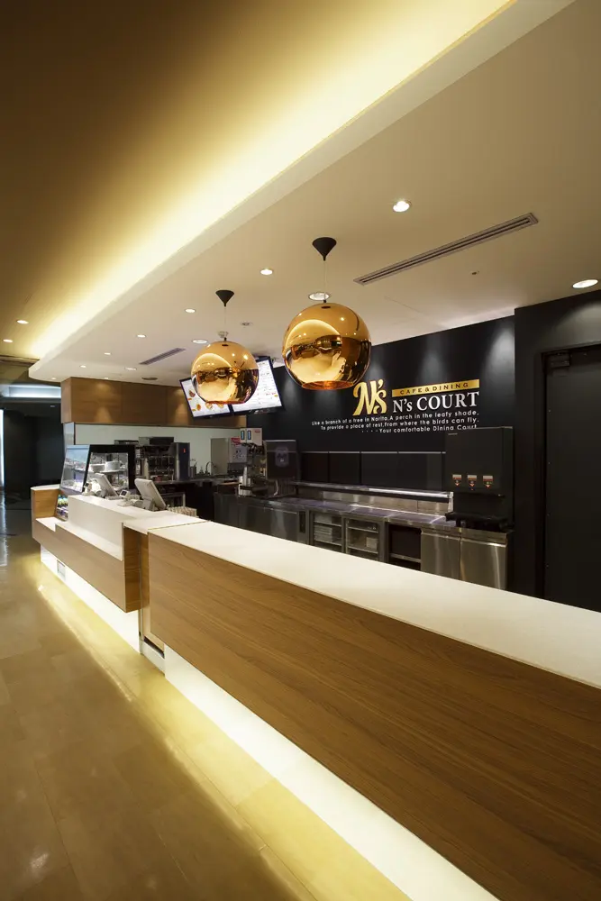 The light-filled order counter is accented with an iconic pendant light.
