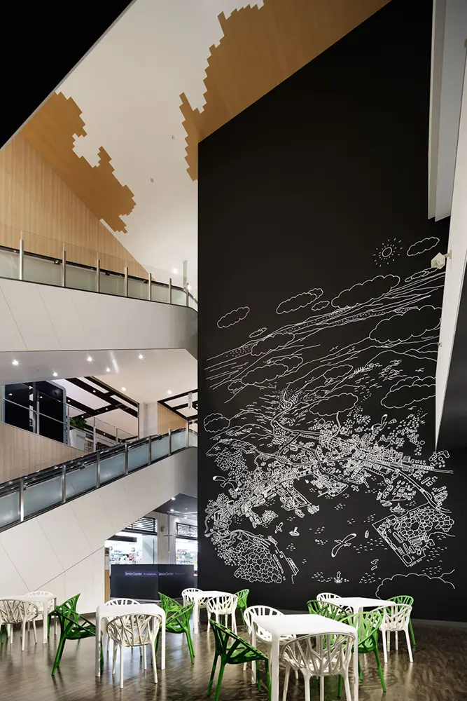 "Atrium Plaza." The illustration on the wall depicts the downtown area of Sasebo. There are also various rest areas within the facility.