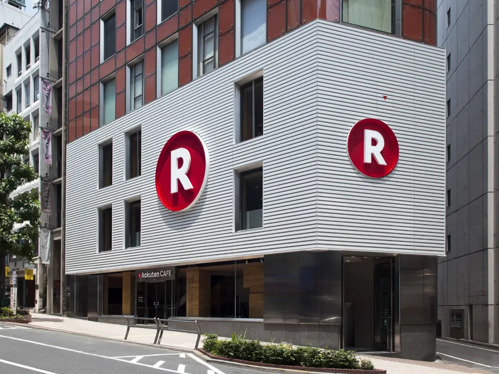 Exterior. Facing Shibuya Koen-dori, the dynamic Rakuten logo sign catches the eye of passersby.