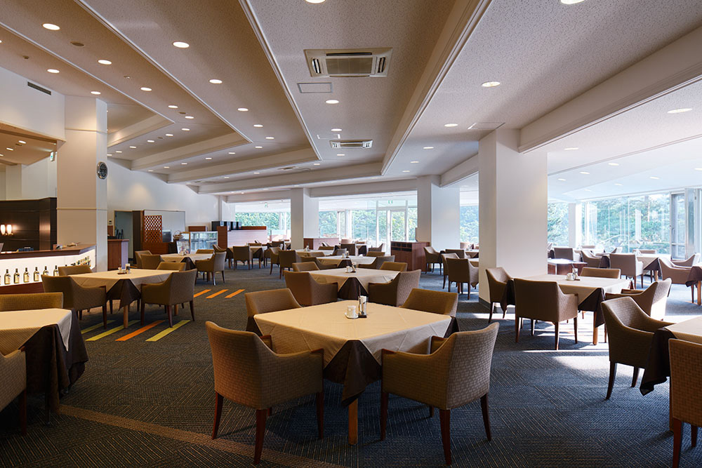 Restaurant. The luxurious white and deep green colors Spatial Production a classy atmosphere.