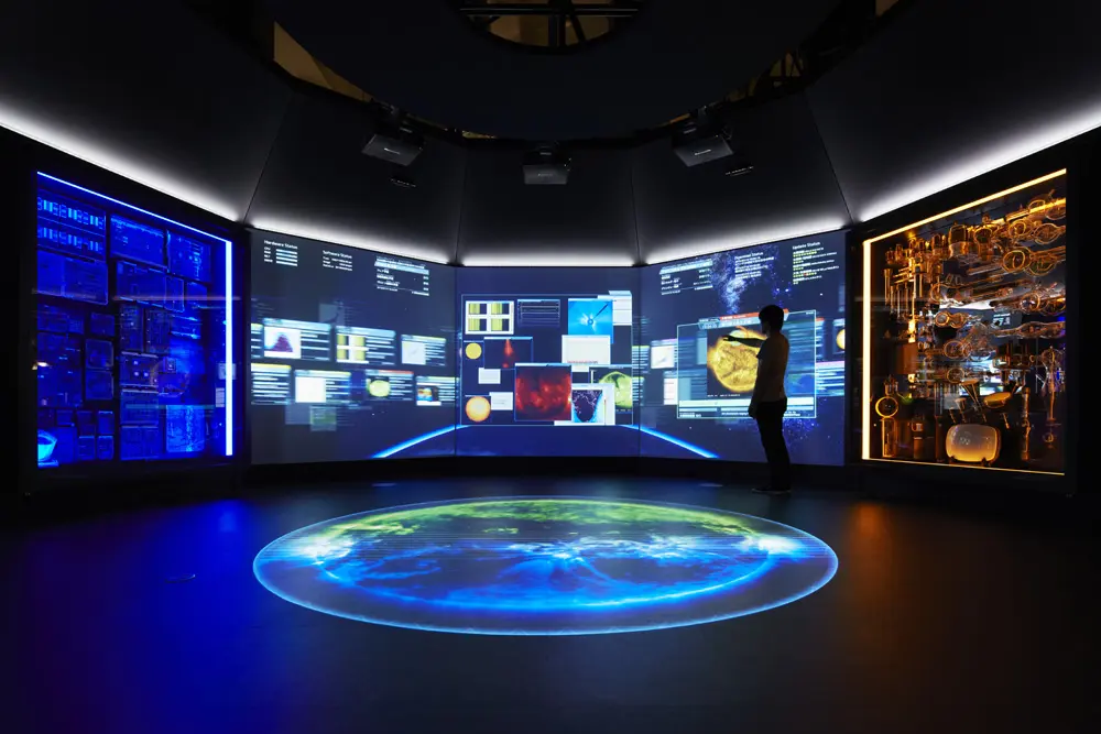 "Exploring the Earth with Science and Technology" Various Earth observation data appears on a large screen, which can be manipulated by placing your hand over it.