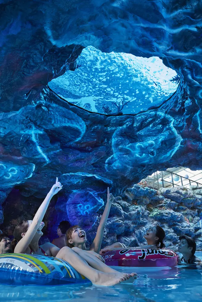 Fish swim overhead and flickering rays of light stream into the cave.