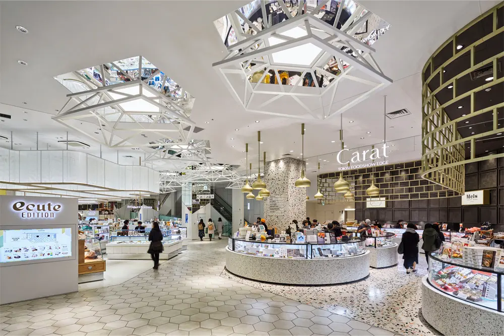 For the lower entrance floors, we incorporated multi-angled objects to represent the many gatherings and pockets of communication that occur inside marketplaces.