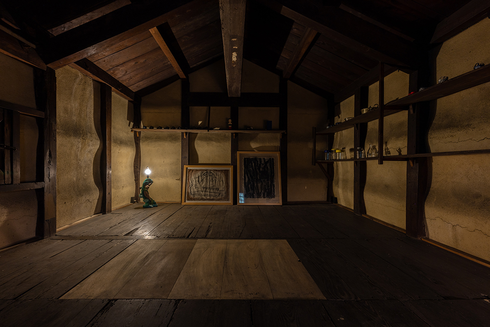 At the back of the site is a storehouse that is about 100 years old. With only lights lit in the existing space, the store owner's collection is carefully stored there.