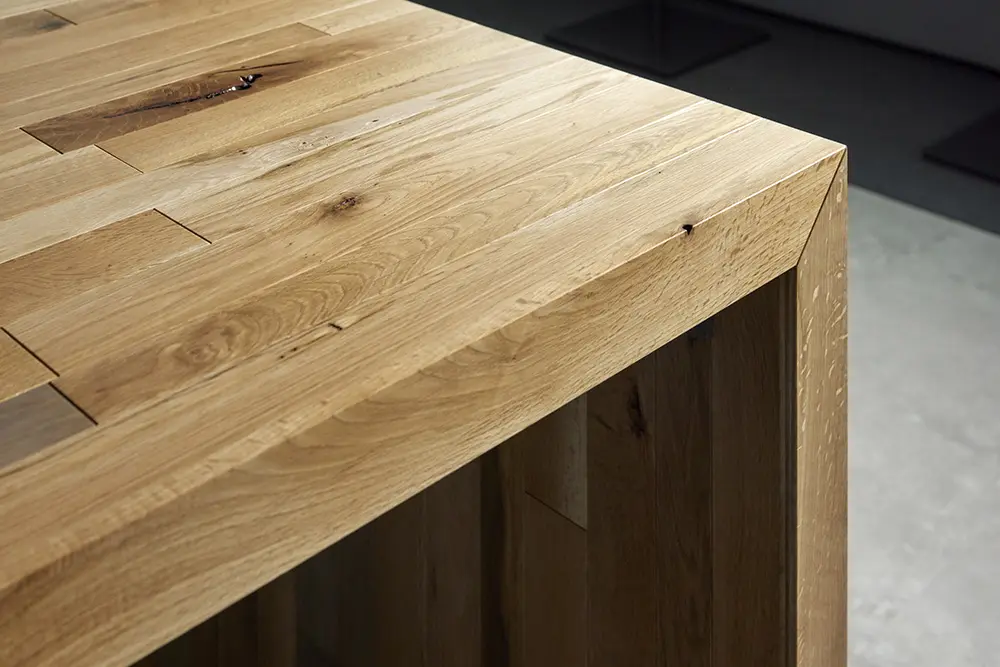 The finish is expressive, taking advantage of the knots, wormholes, and discoloration that are characteristic of dead oak wood.