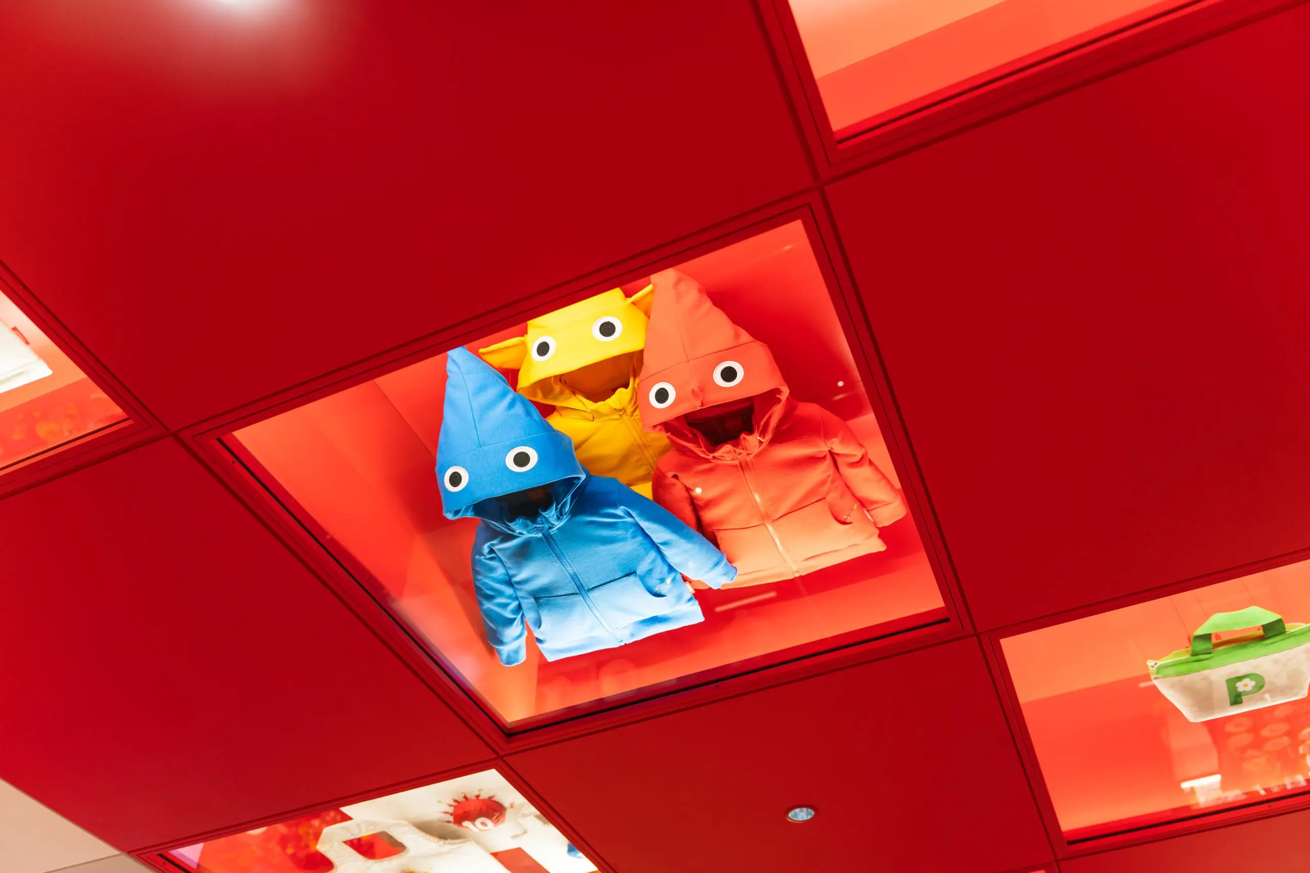 The ceiling display above the red path is arranged in a checkerboard design showing some of the regular products.*