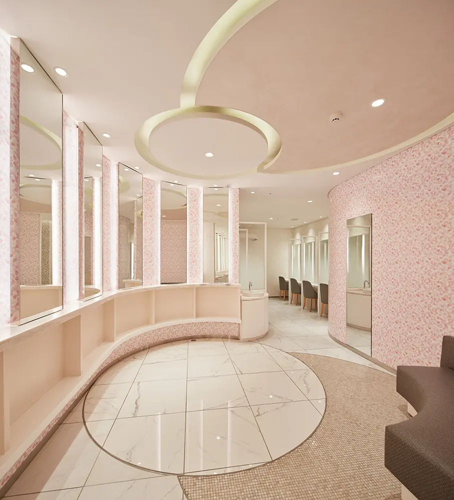 The powder room is themed around "Castle Town Elegance," and is designed with a floral motif, lustrous textures and soft forms.