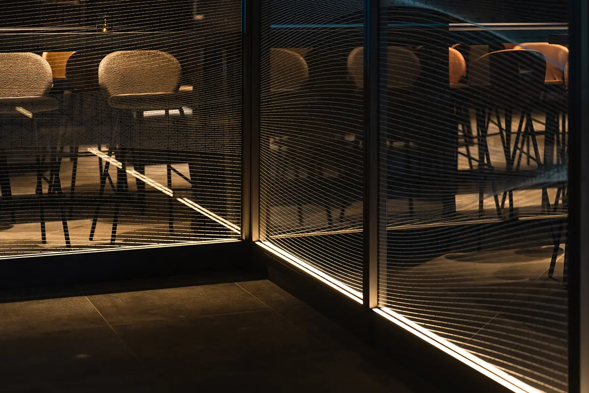 Glass screens gently divide the space