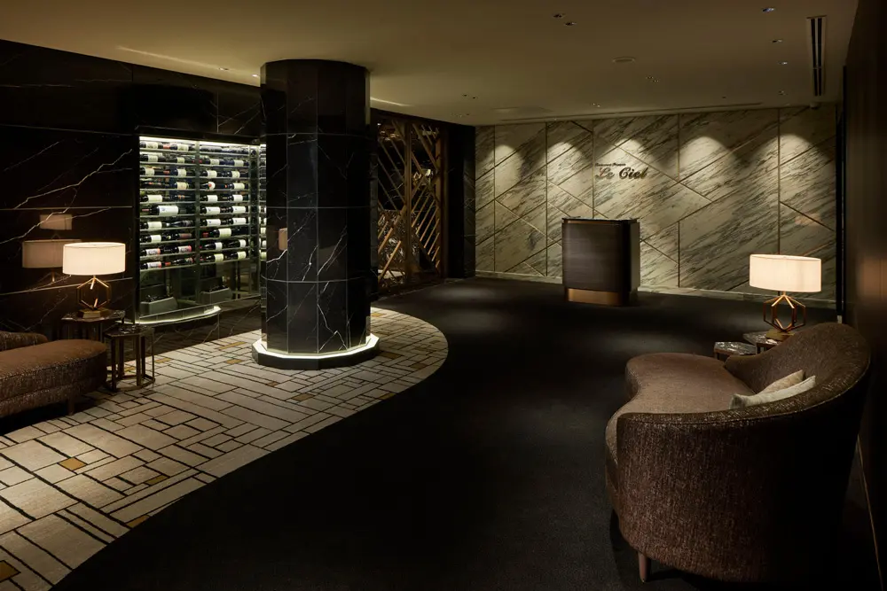 The hotel's top floor elevator hall blends in with the restaurant's facade.