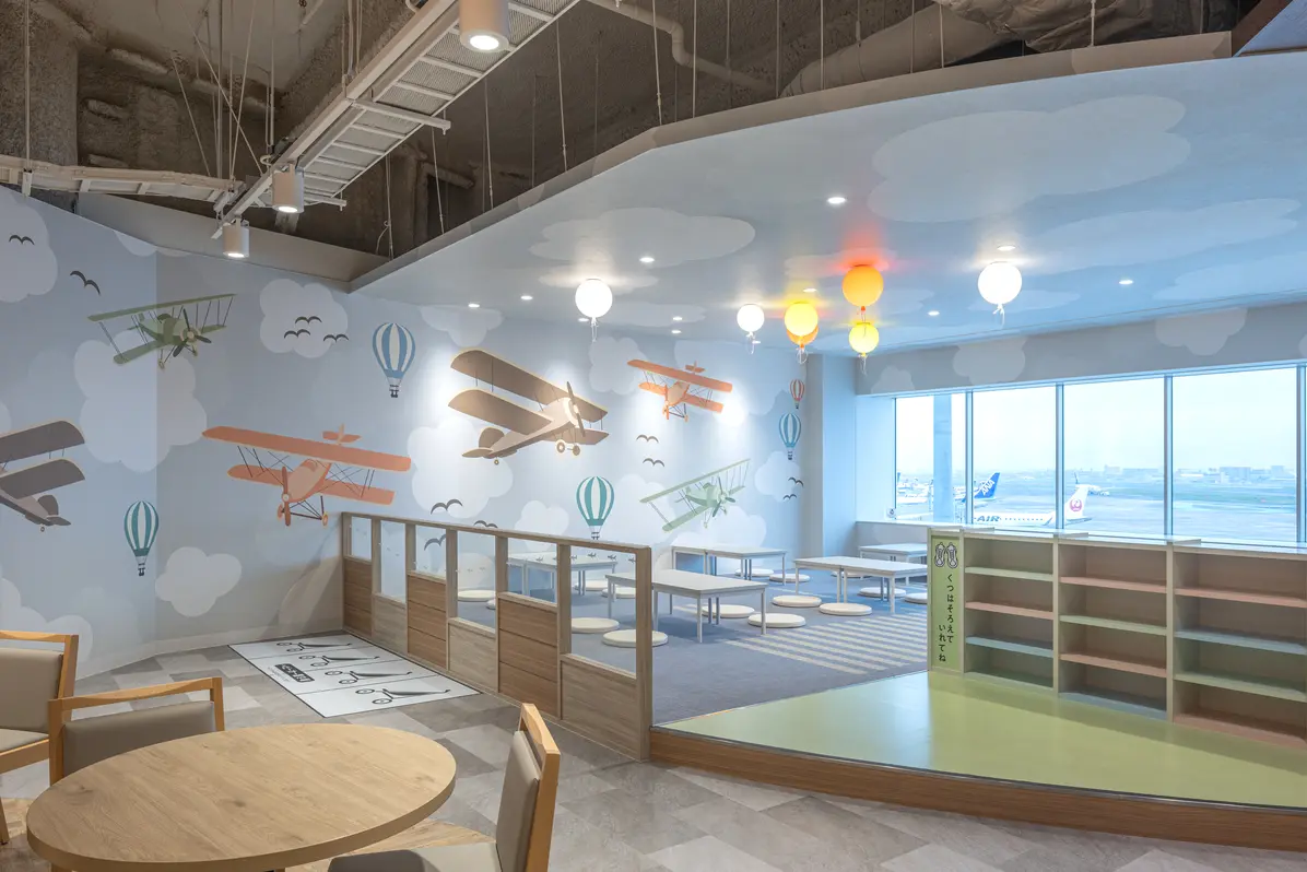 Family Area: A playful space featuring colorful depictions of airplanes soaring through the sky.