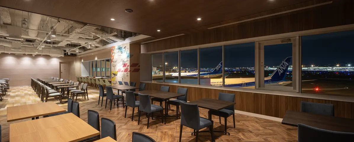 At night, you can see the runway illuminated by lights.