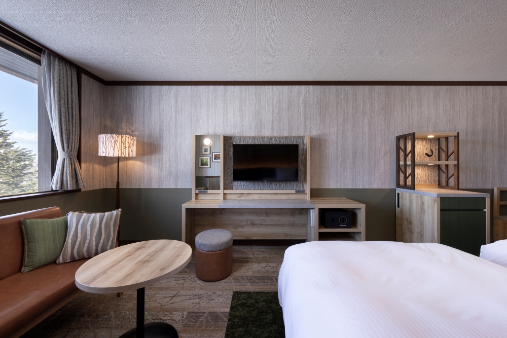 A stand lamp with a silhouette of trees that expresses sunlight filtering through the leaves and a minibar with a design inspired by trees