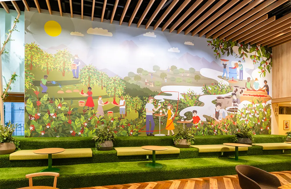 The entire wall is decorated with a huge graphic depicting the story of "farm to cup," from the coffee plantation to the production of a cup of coffee.
