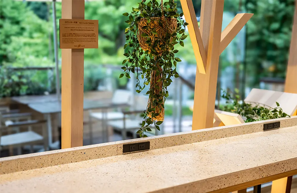The countertop is made from a mixture of recycled "Nescafe Eco & System Packs"