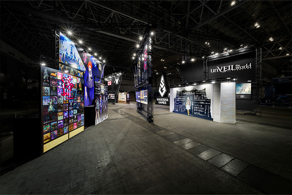 On the left side of the booth, behind the newly announced "unVEIL the world" exhibit, the graphics for "Ukiyo" and "SOULVARS" are laid out to catch your eye.